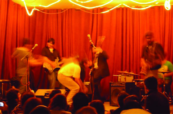 The band peaks during a performance